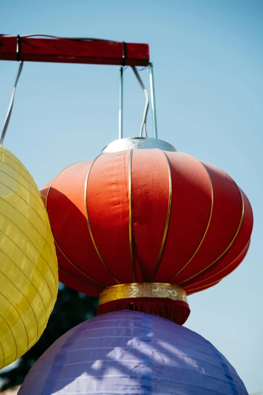 a couple of big lanterns are hanging in the air