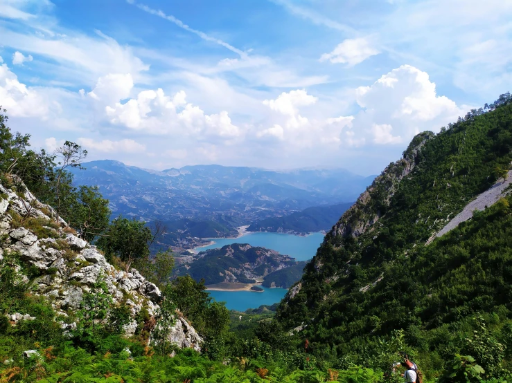 the mountains have some water and a small lake