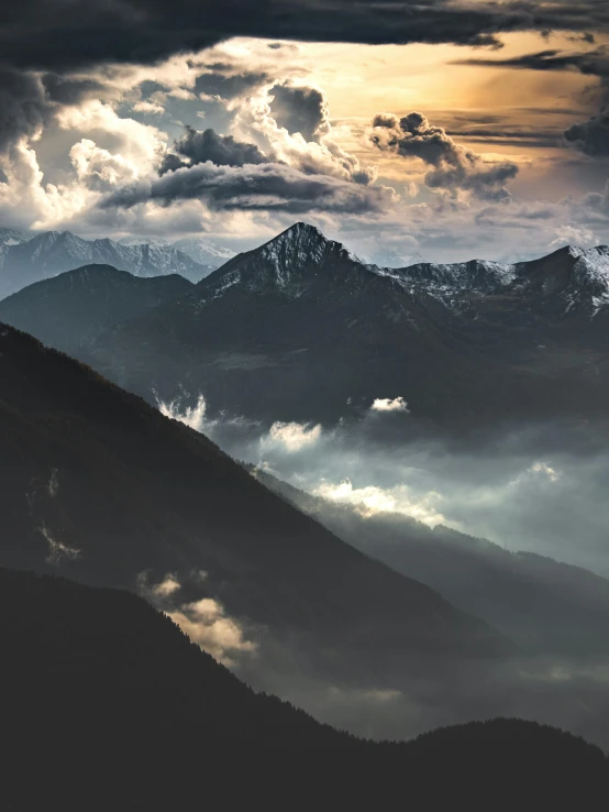 an image of a dark mountain scene with a sky background