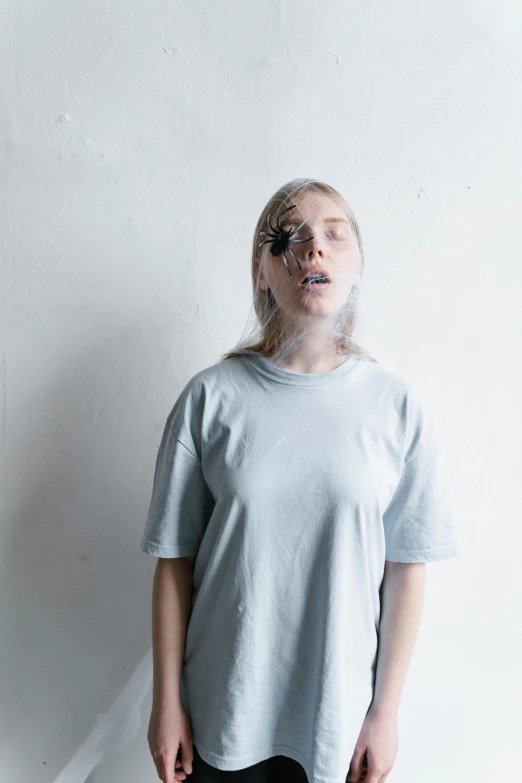 woman standing in front of wall with large plastic bubble