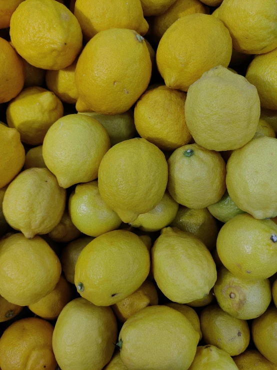 a bunch of lemons are piled on top of each other