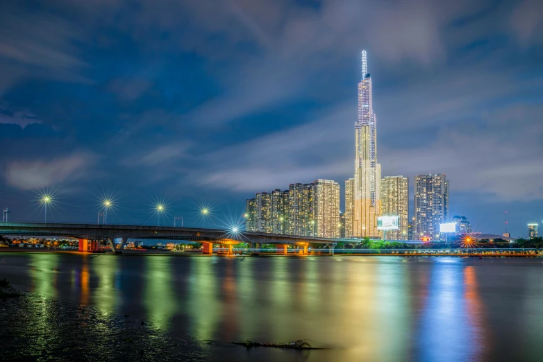 a nighttime po showing a city and its water