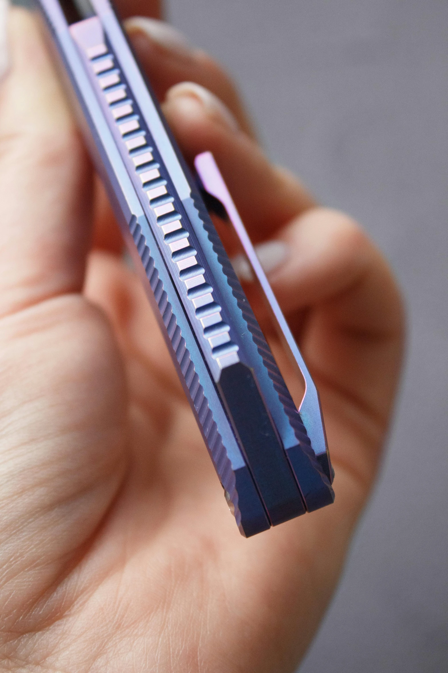 a closeup of a person holding a toothbrush in their hand