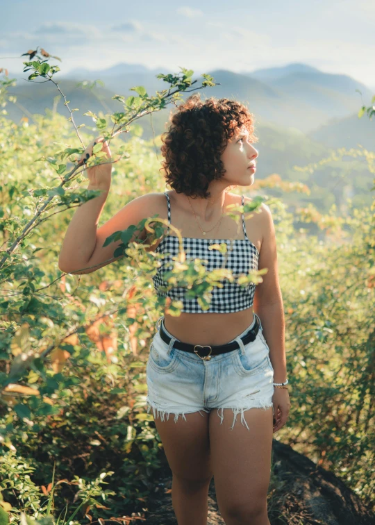 a close up of a person wearing short shorts