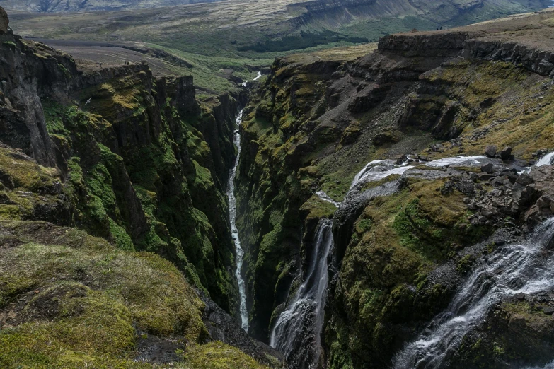 the landscape of a mountain range with a river