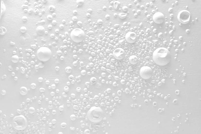 a close up view of white water bubbles