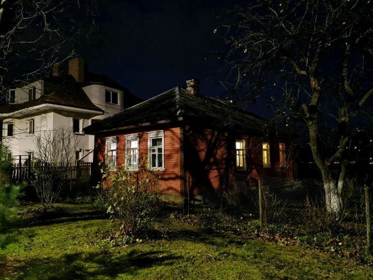 a building on a dark night with the light on