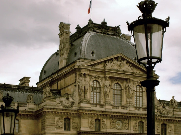 a building with a big tower near some street lamps