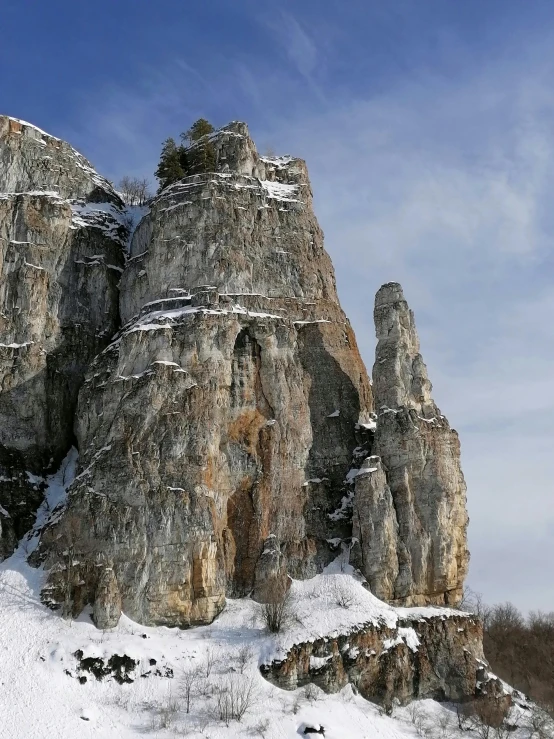 there is a very tall mountain on a cold day