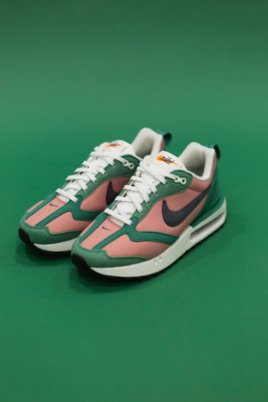 a pair of green, pink and white sneakers