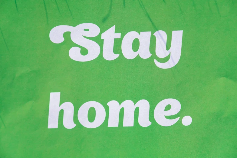 the words stay home painted on an athletic 