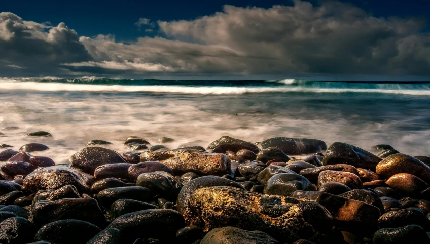 a long exposure of waves crashing on some rocks