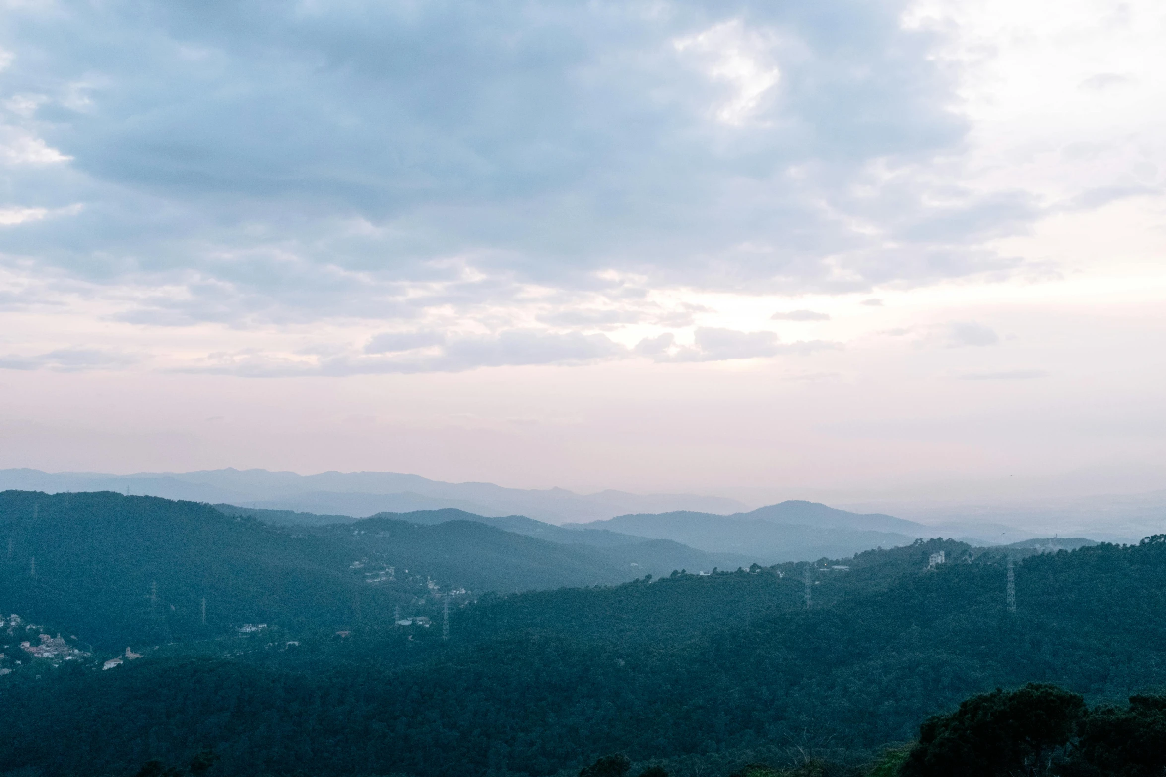 a view looking down the mountains of the countryside