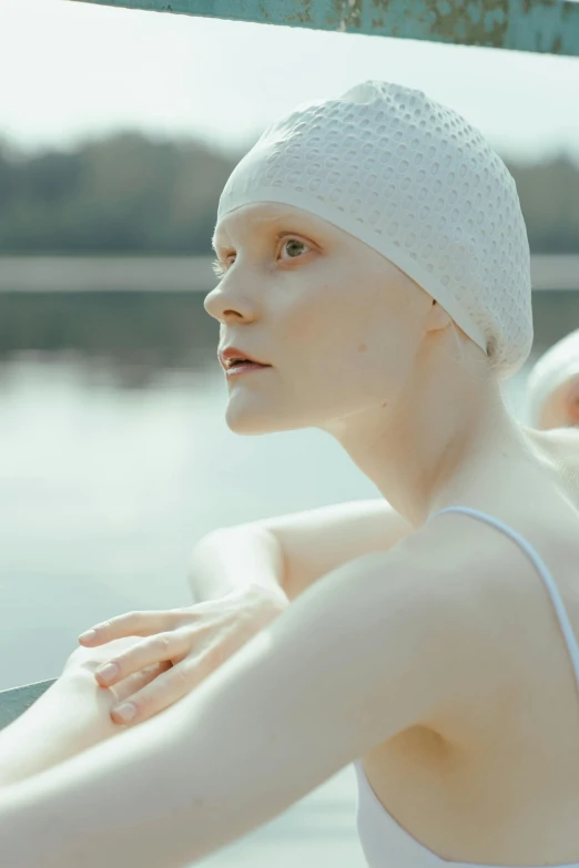 a woman that is wearing a towel on her head