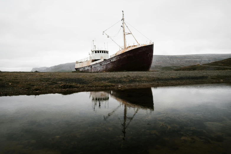 the small boat is in the open water