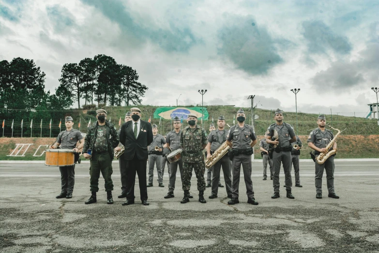 several men are playing instruments on the dirt