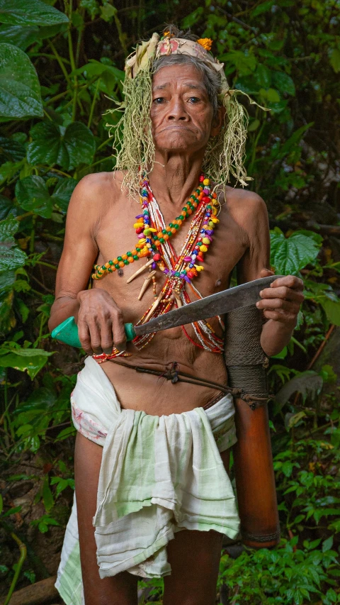 a man with a knife in his hand holding onto another mans shoulder