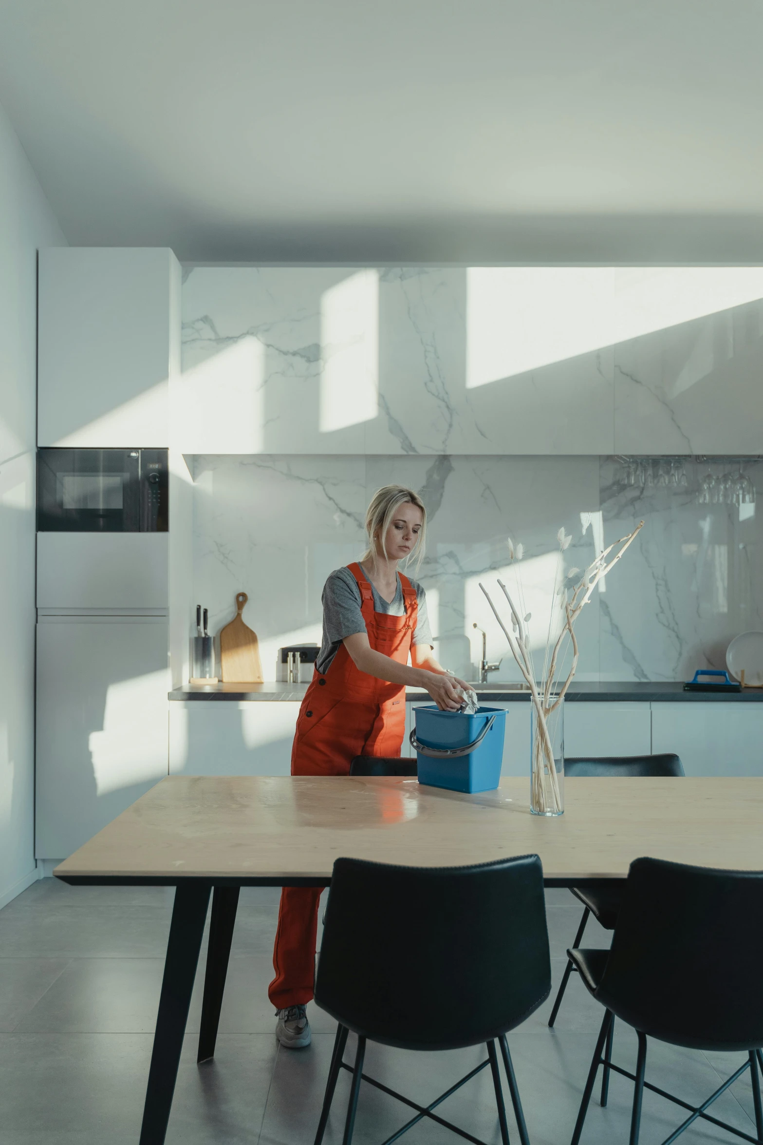 a woman is painting on the counter top