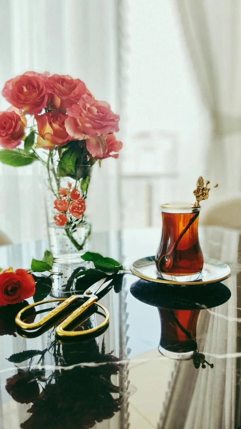 an elegant table set for two with pink roses