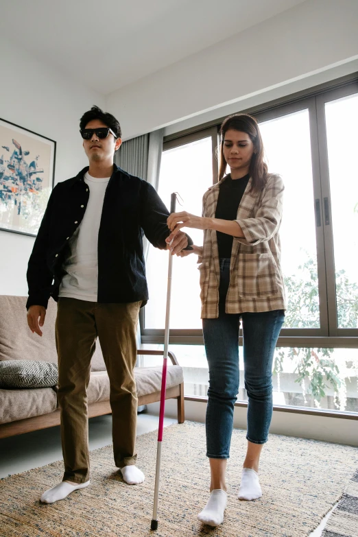 man and woman playing crutches in a living room