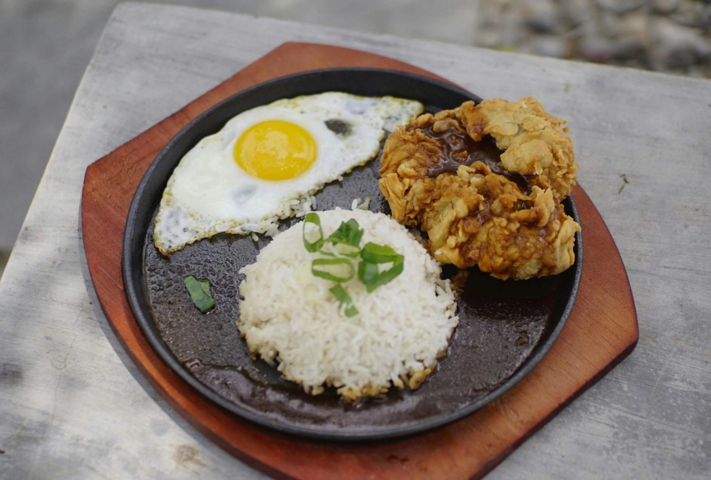 a plate of food has eggs and rice on it