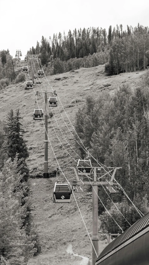 some cars that are sitting out side on some tracks