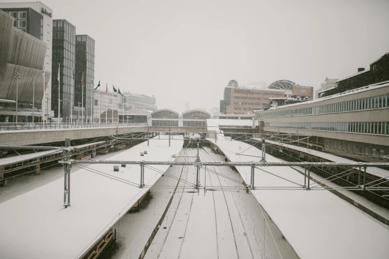 a train traveling along a snow covered tracks