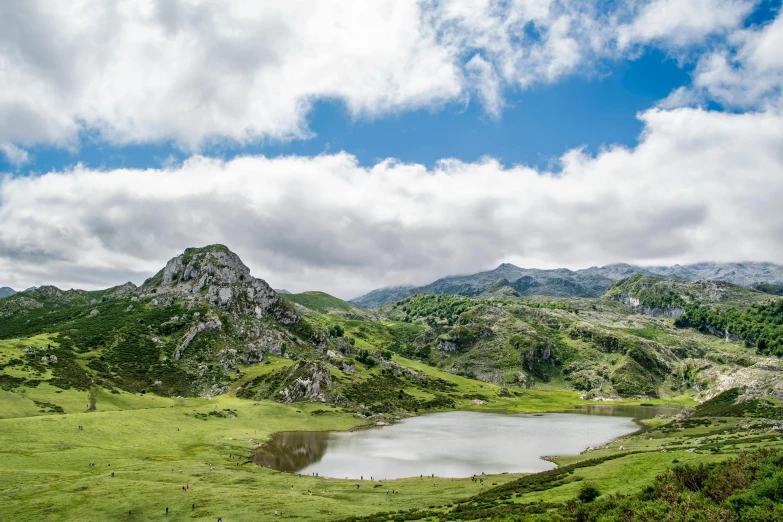 a view of some hills and a lake