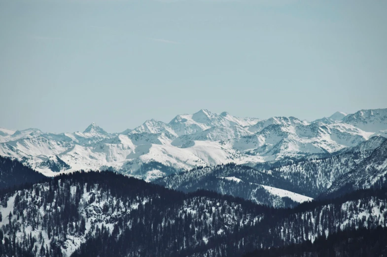 mountains covered in snow and blue sky during the day