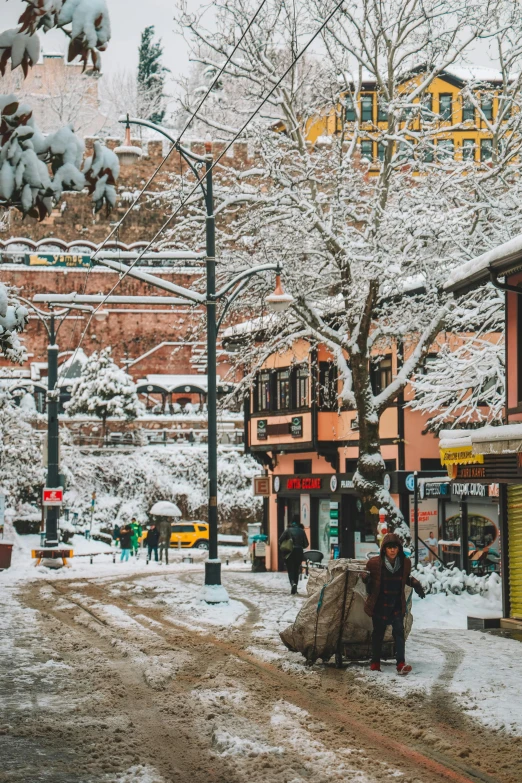 a person walks through a snowy street area