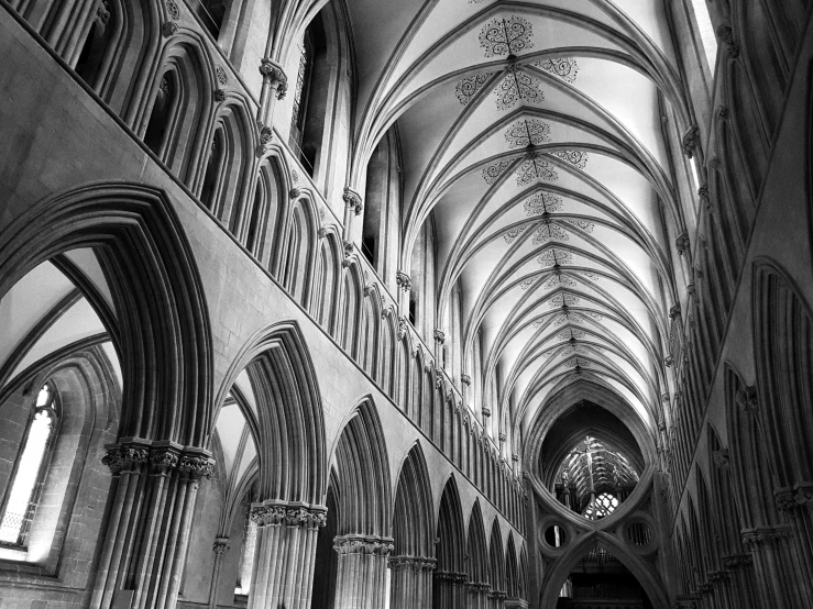 an empty cathedral has two large pews