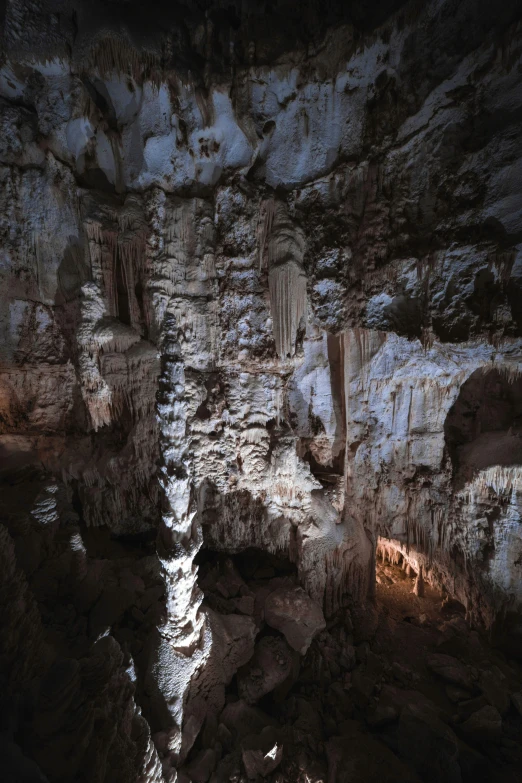 this is a cave type structure with some large, stalate formations