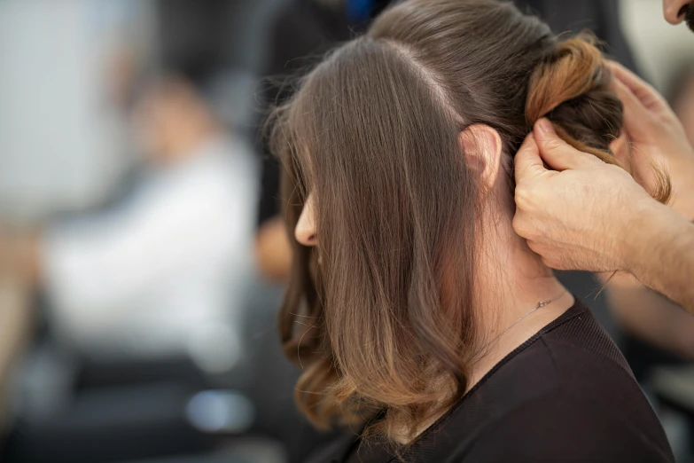 a hairdresser  the hair of a woman