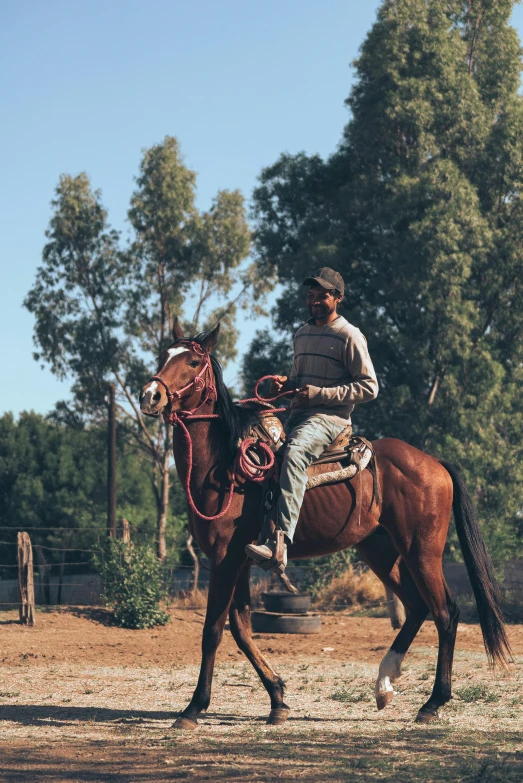 a man riding a horse around a field