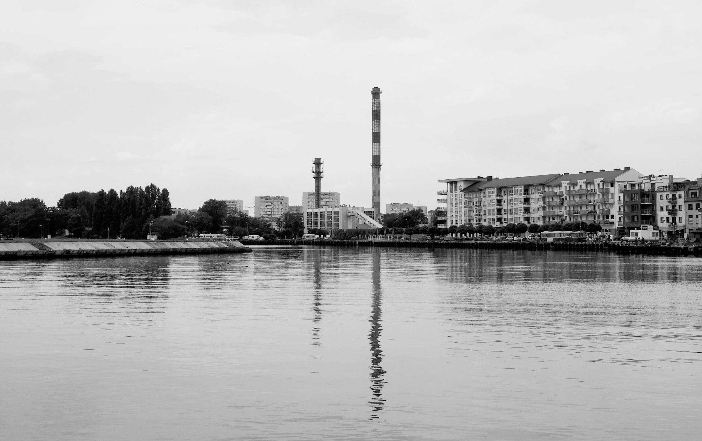 the water is so quiet of the place where i can see the power tower