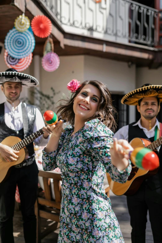 a mexican band playing musical instruments and singing