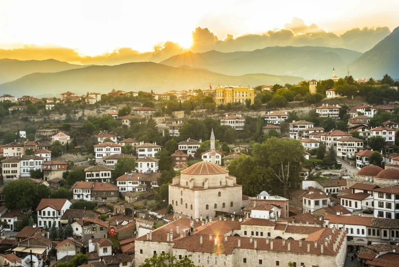 an aerial s of some buildings near mountains