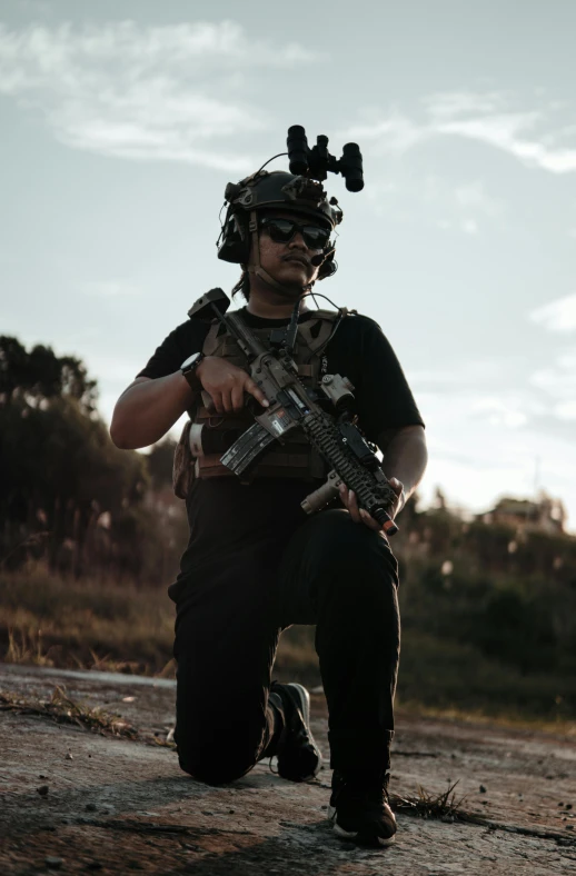 a person with an arg rifle in his hand