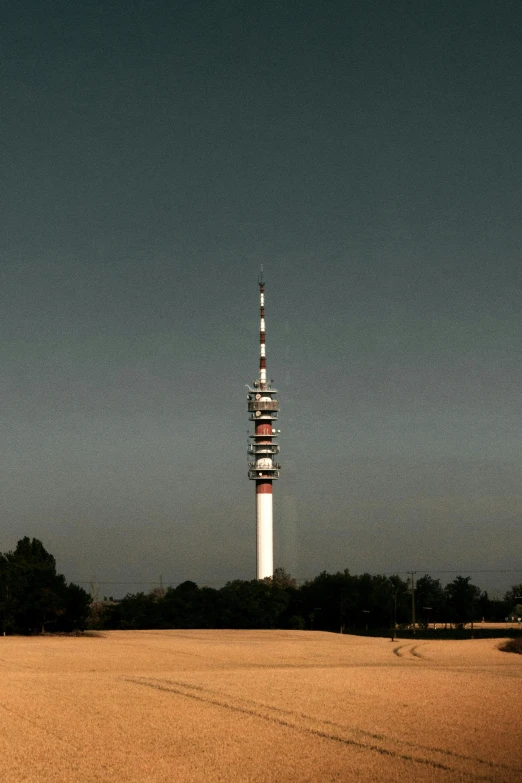 a tower is sitting in the middle of a field