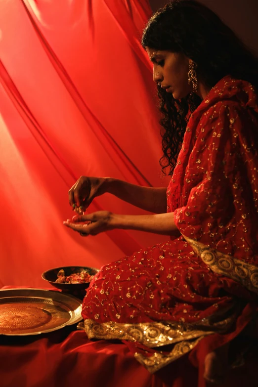 a woman sits down to eat a plate of food