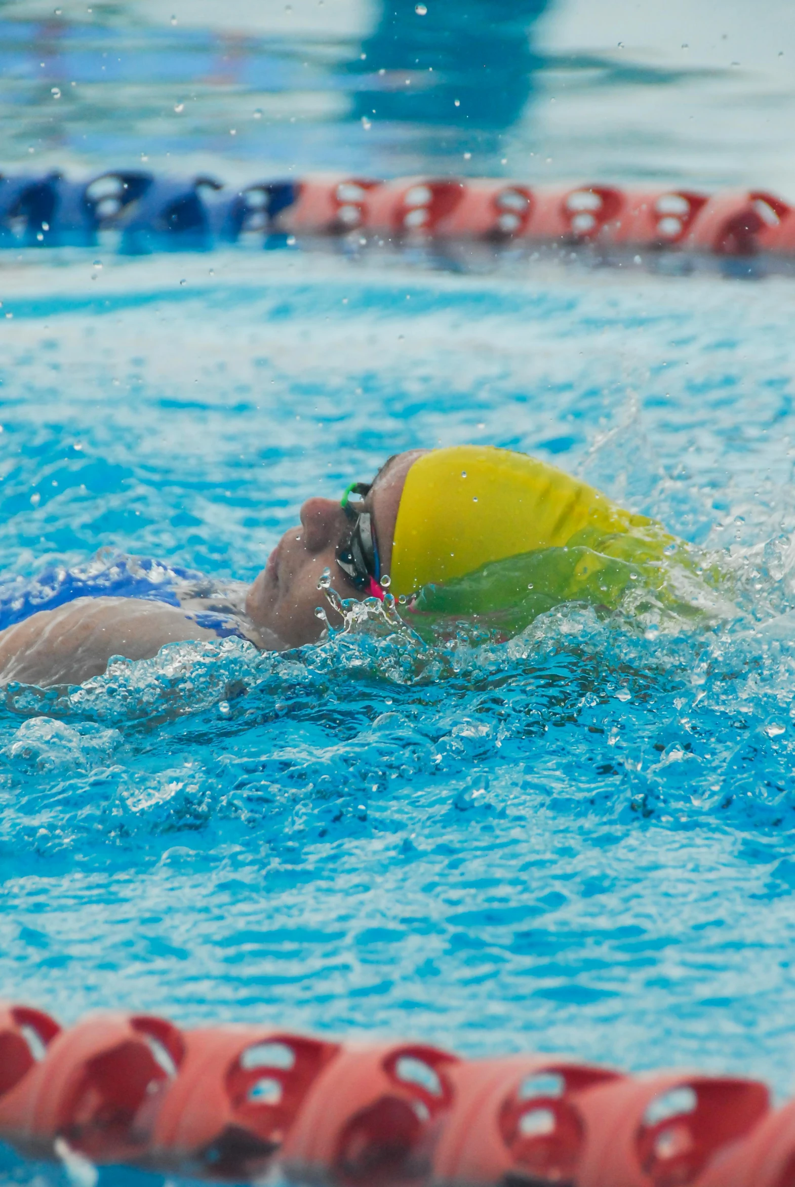 a swimmer is out in the pool during the race