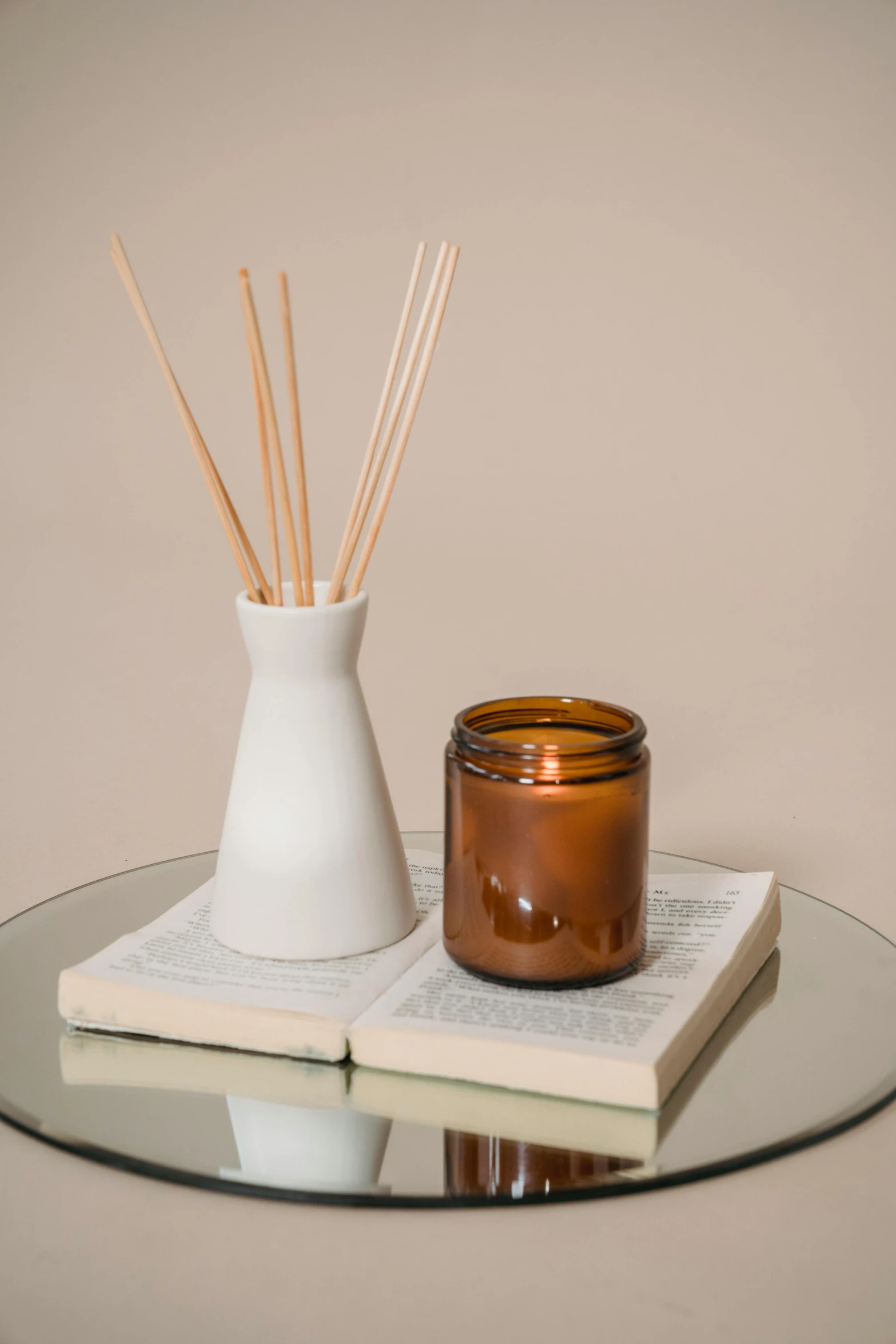 a candle and an open book with candles