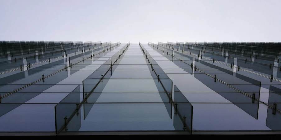 rows of glass windows in front of a clear sky