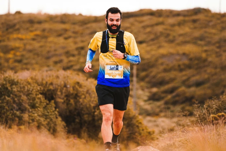 a man running in the middle of a path