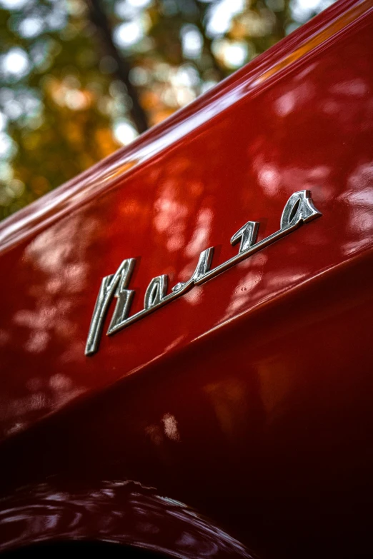 a closeup of the back end of a red classic car