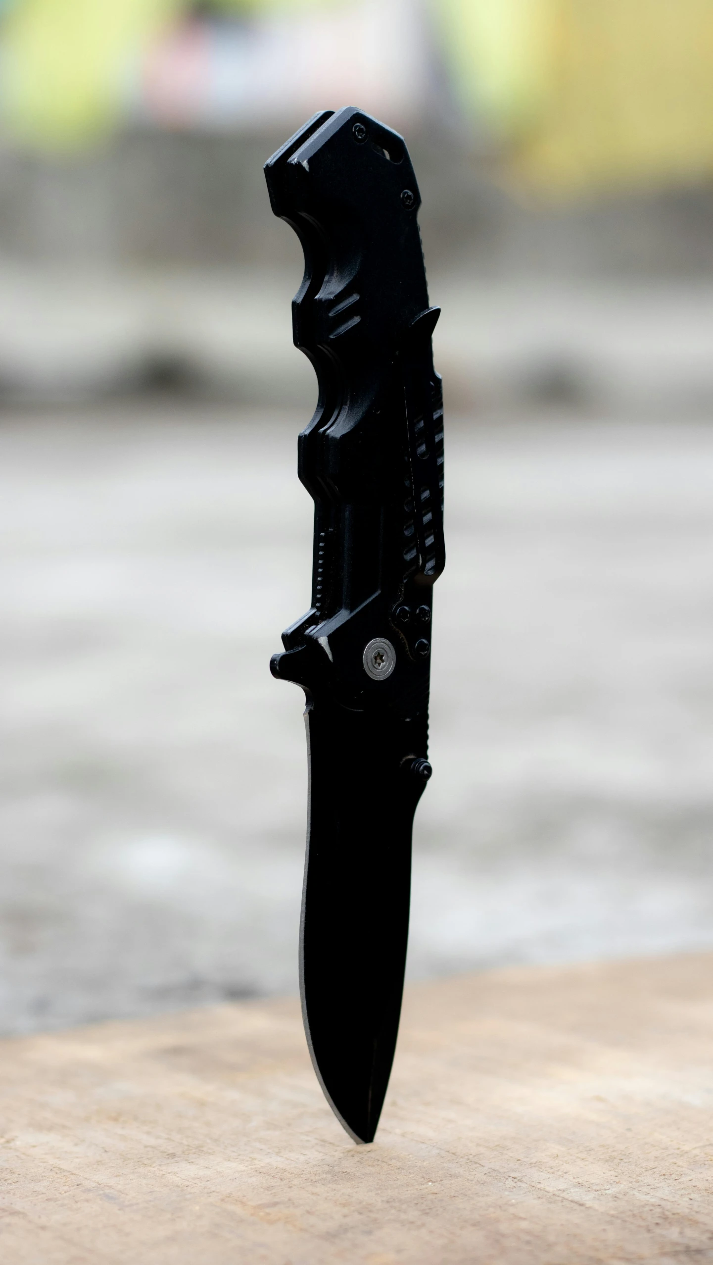 an open folding knife with a blade sticking out