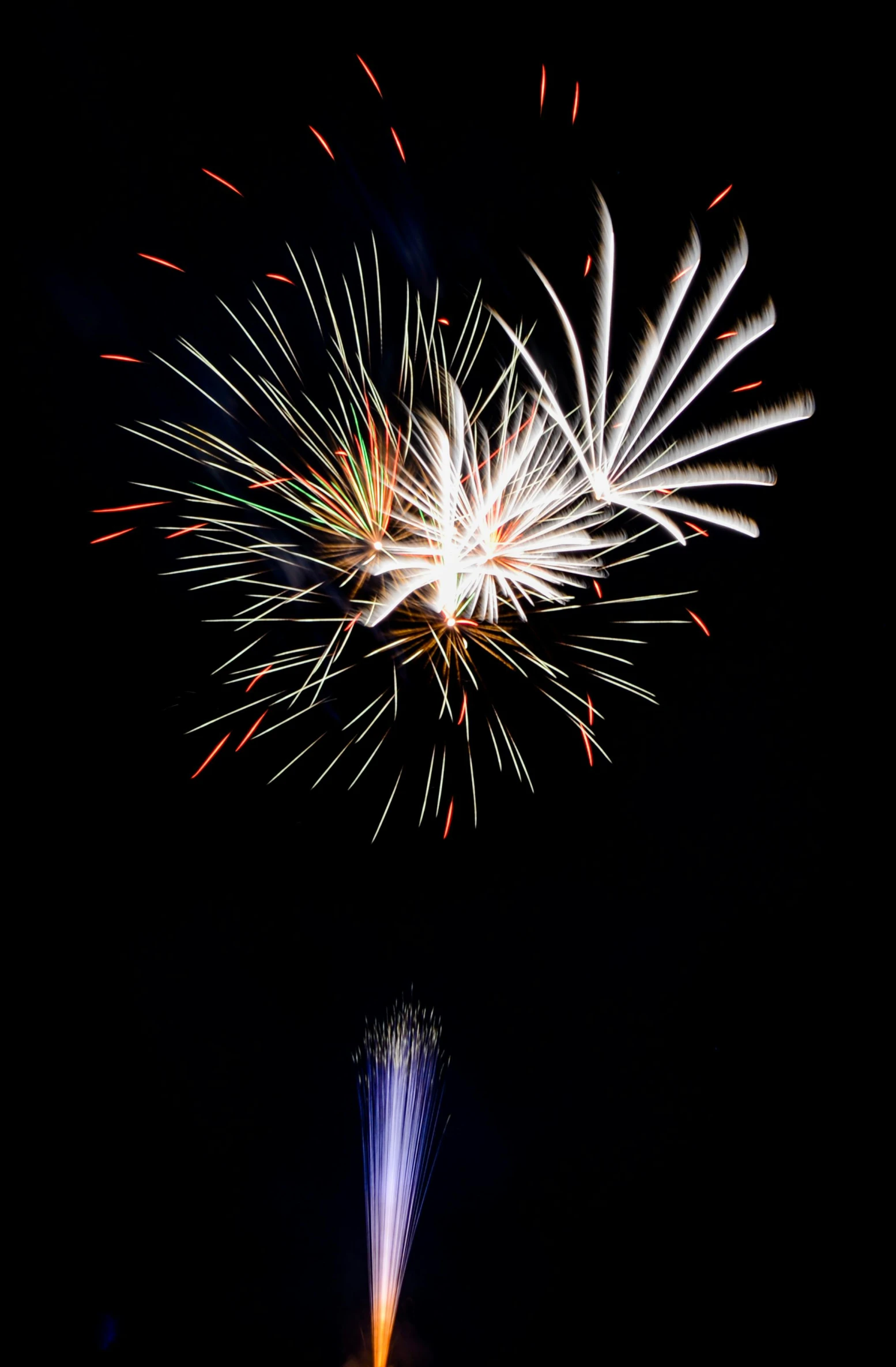 a large fireworks show with the blue flame