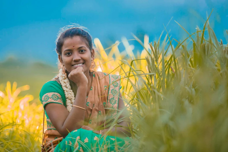 a woman poses with her arms on her face outside