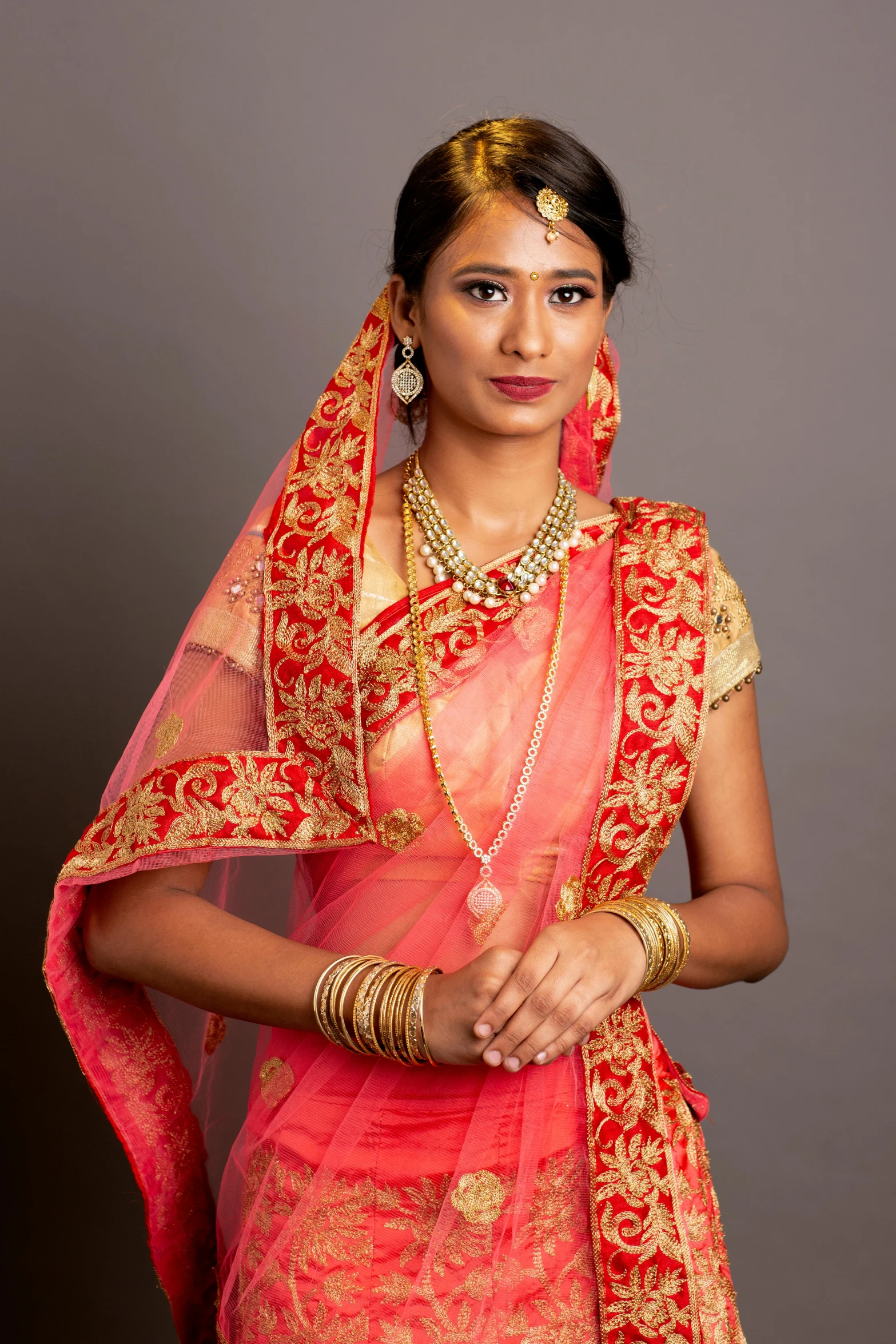 a beautiful young lady dressed in an indian dress