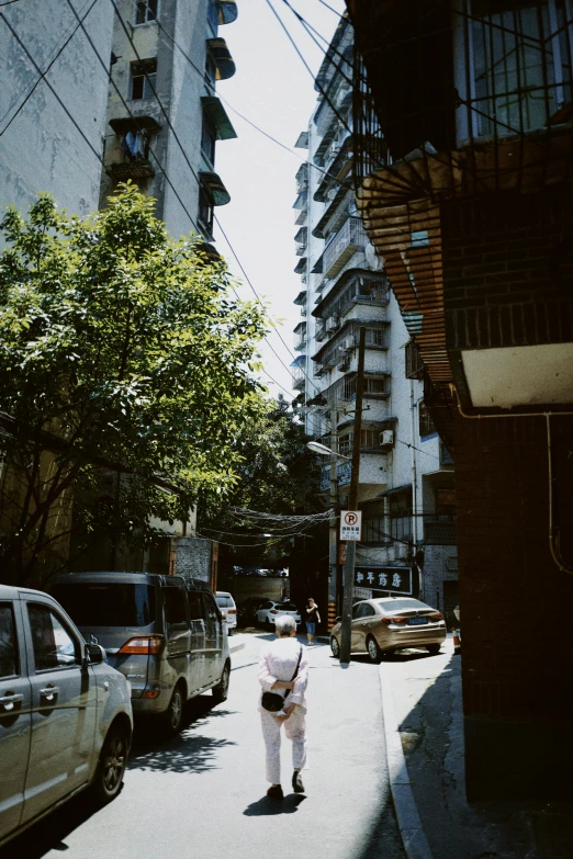 two people that are standing in the street